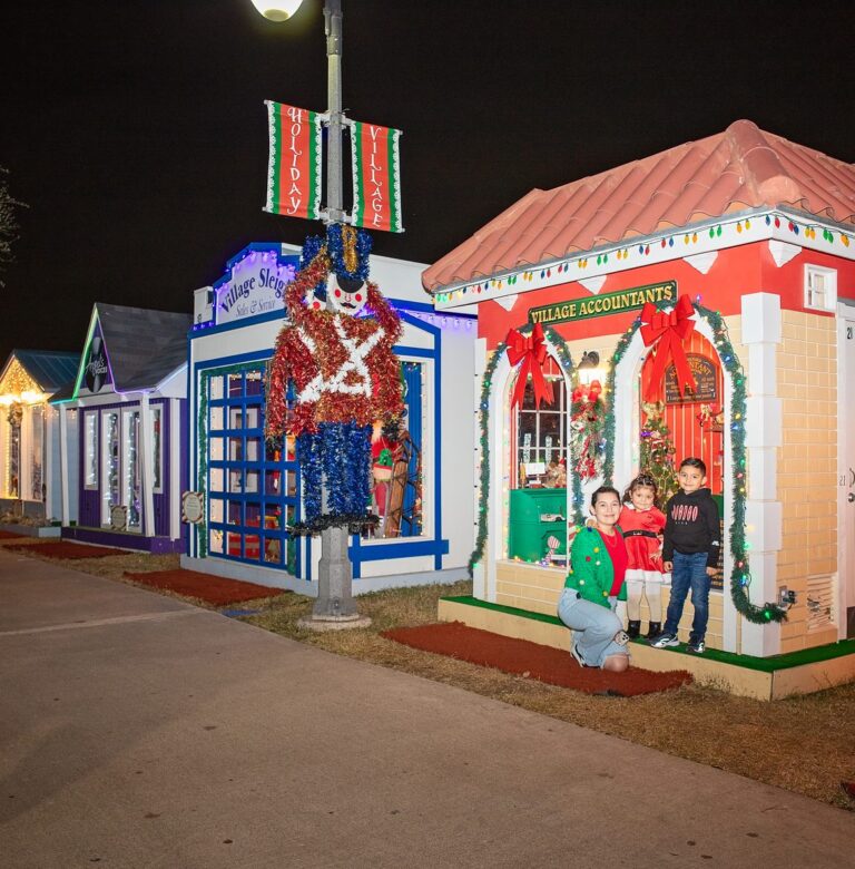 Holiday Village lit up at night in downtown Brownsville