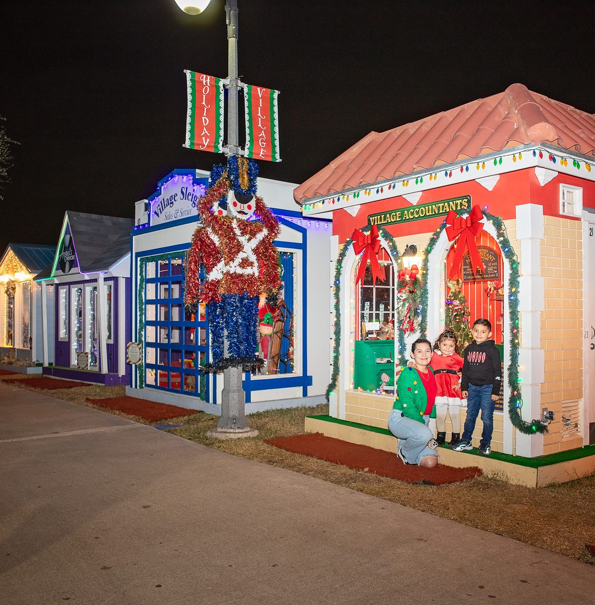 Holiday Village lit up at night in downtown Brownsville